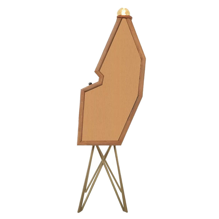 Side view of the Maison Roshi Senpai V1 upright arcade cabinet showcasing its unique sculptural wooden design with mid-century style brass legs and vintage bulb.