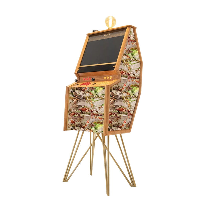 Maison Roshi Senpai V2F upright arcade machine featuring a colourful bohemian-style textile design with red and yellow controls and brass tripod legs.