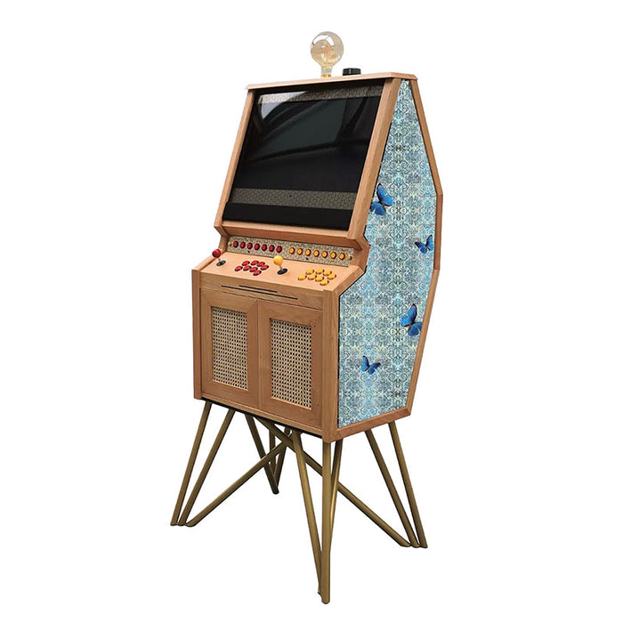 Maison Roshi Senpai V3 arcade cabinet in wood finish with gold legs and side panel decorated with blue butterflies on patterned background.