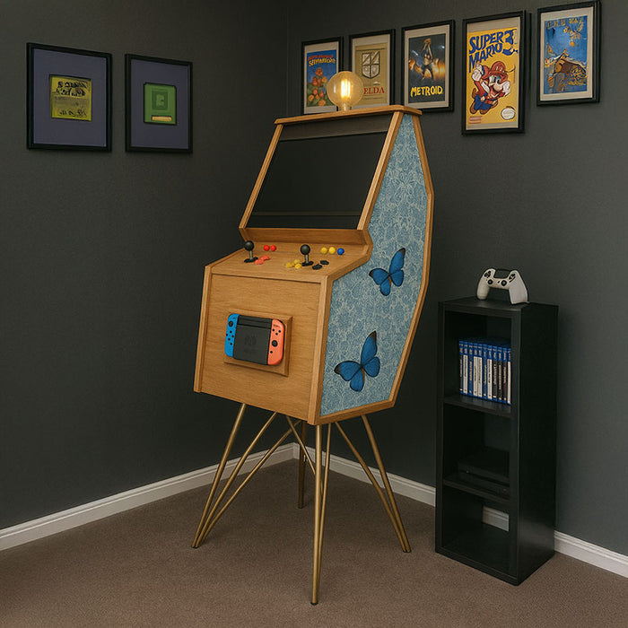 Maison Roshi Senpai V3 Lite arcade cabinet in gaming room with blue butterfly patterned side panel, wood frame, gold legs, and Nintendo Switch dock.
