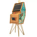 Maison Roshi Senpai V3 Lite arcade cabinet with turquoise botanical side panel, wooden body, gold legs, and Nintendo Switch dock.