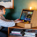 Maison Roshi Sensei V1 retro arcade console with yellow and red joysticks, in use by a player scrolling through Pandora’s Box game menu in a home gaming setup.