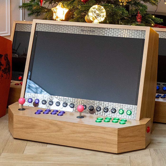 Maison Roshi Sensei V3 arcade cabinet in festive decor, with a polished oak frame and LED bulb accent, ready for retro gaming under the Christmas tree.