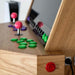 Detailed side angle of Maison Roshi Sensei V3 arcade system showing joystick buttons, vibrant controls, and refined wood craftsmanship.