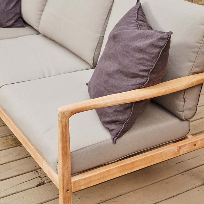 Close-up view of Malta Outdoor Corner Seating Set, showing wooden armrest and cushions.