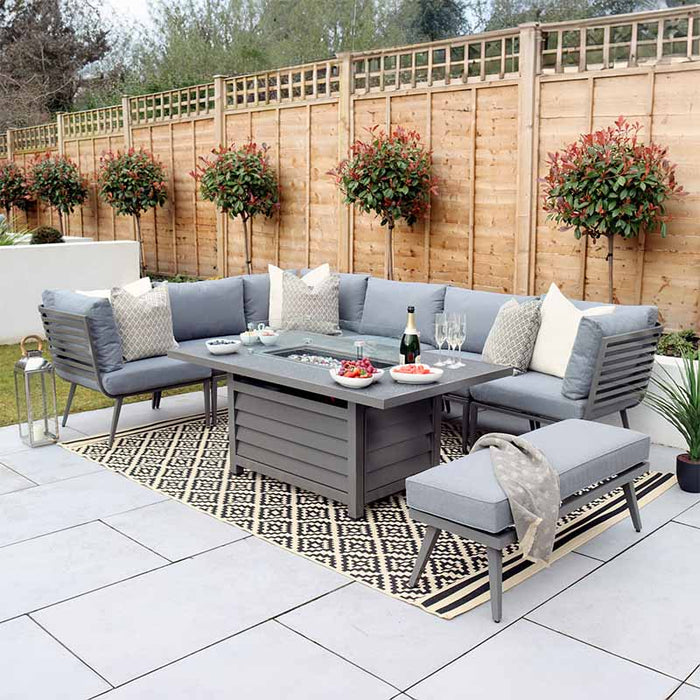 Mayfair Corner Lounge Set with Fire Pit Table & Bench in a modern grey finish, perfect for outdoor gatherings.