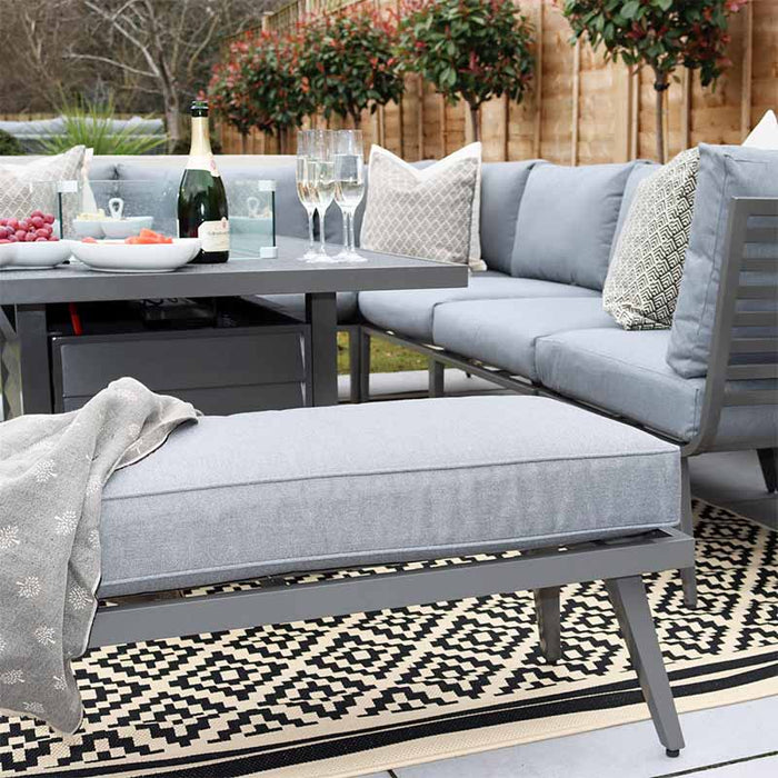 Mayfair Corner Lounge Set with Fire Pit Table & Bench, blending comfort and style in an outdoor setting.