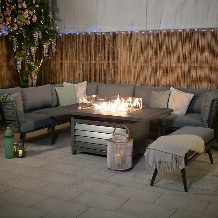 Evening lifestyle setting of the Mayfair Lounge Set with Fire Pit, creating a warm, inviting atmosphere.