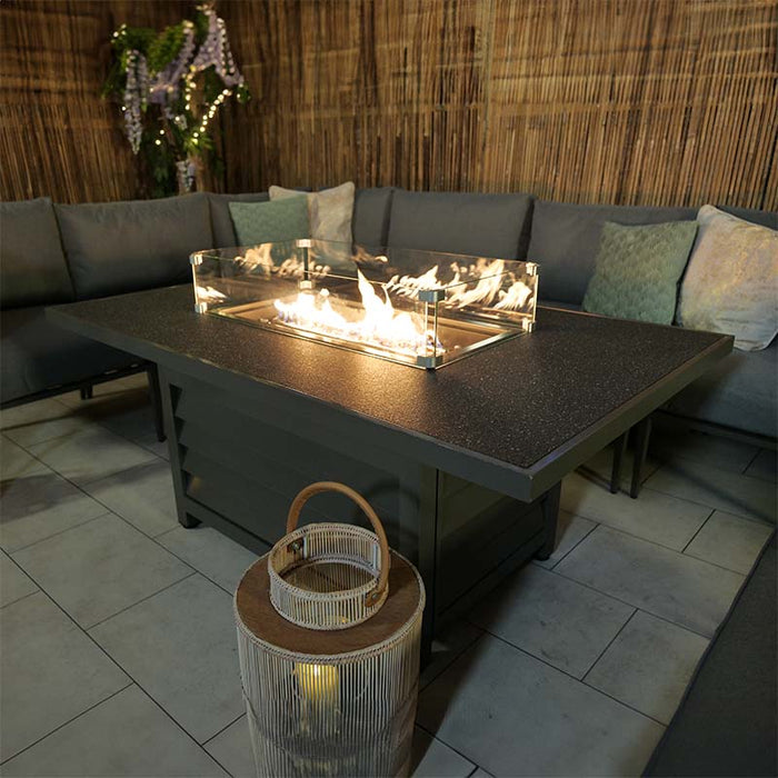 Close-up of the Mayfair Fire Pit Table, showcasing its elegant design in a relaxed outdoor setting.