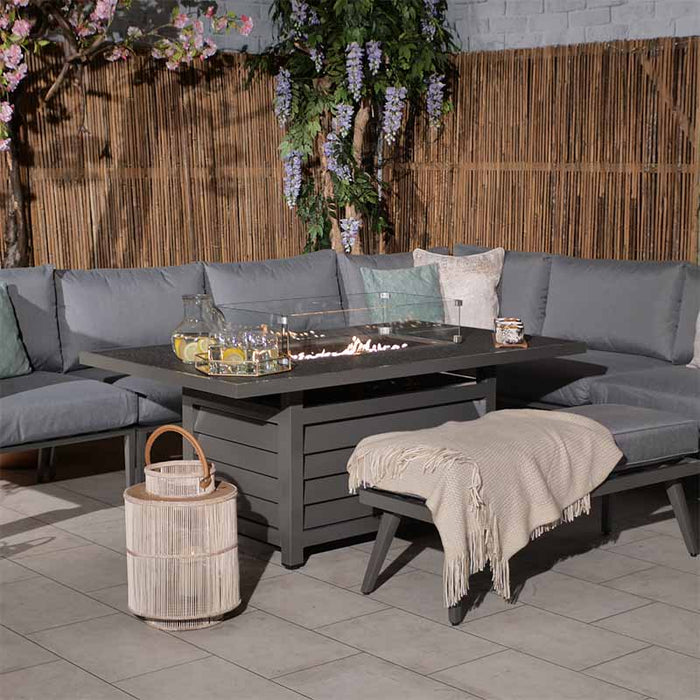 Mayfair Lounge Set with Fire Pit, styled with decorative accents for a modern outdoor space.