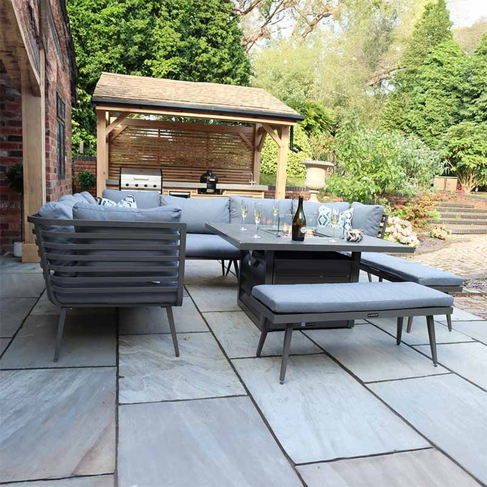 A modern Mayfair Lounge Set with Fire Pit and Benches enhances any garden setting with comfort and style.