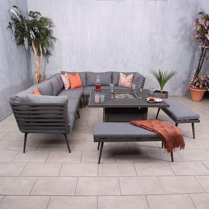 The Mayfair Corner Lounge Set with Fire Pit Table & 2 Benches displayed in a sophisticated indoor environment, showcasing the spacious seating and modern design.