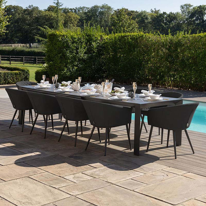 Ambition 10 seater extending dining set in charcoal, arranged for modern outdoor dining by the poolside.