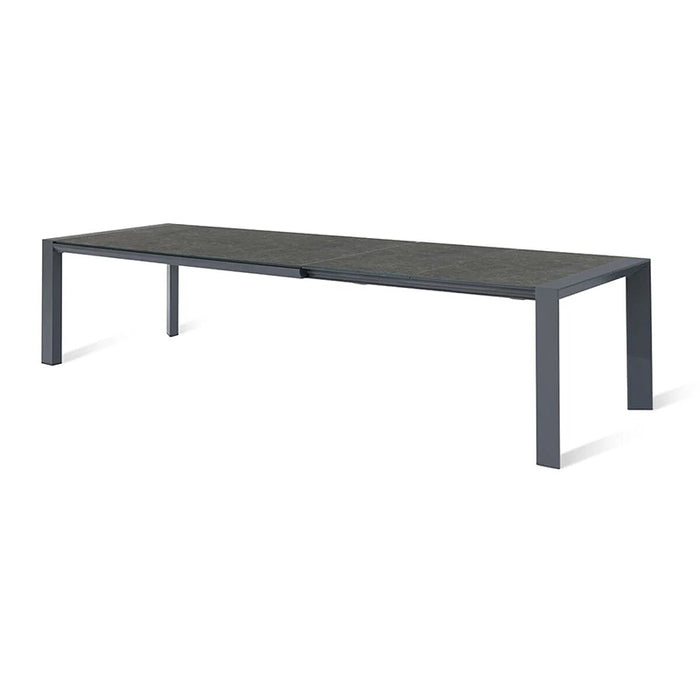 Ambition 10 seater extending dining table in black, providing a sleek and durable surface for large outdoor gatherings.