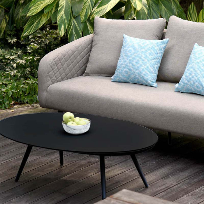 Lifestyle shot of Ambition 3 Seater Sofa and armchairs in taupe, arranged on an outdoor deck.