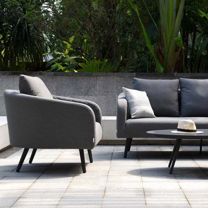 Side view of the Ambition 3 Seater Sofa Set armchair in Flanelle, highlighting its plush cushions and curved arm design.