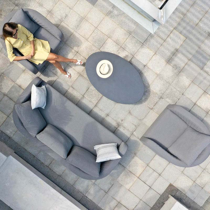 Bird’s eye view of the Ambition 3 Seater Sofa Set in Flanelle, with a three-seater sofa, armchairs, and an oval coffee table, arranged on a stylish patio.