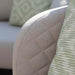 Close-up shot of the cushion details on the Ambition 3 Seater Sofa in oatmeal fabric, showcasing its soft quilted design.