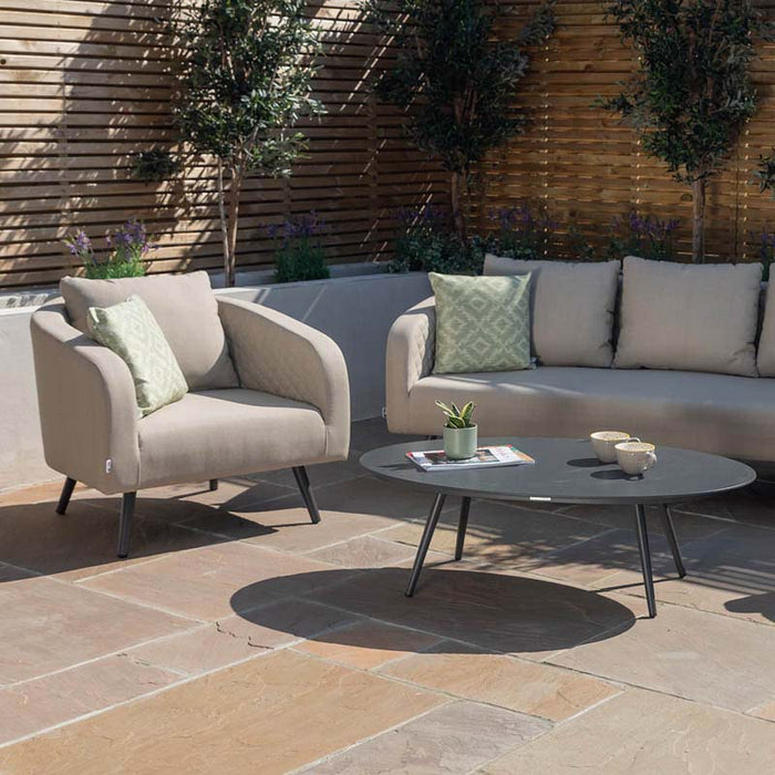 Ambition 3 Seater Sofa Set with armchairs in taupe, displayed in a stylish outdoor patio setting.