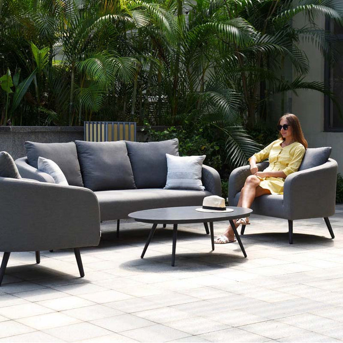 Ambition 3 Seater Sofa Set in Flanelle, arranged on a patio with a modern outdoor setting, showcasing its sleek design and comfortable seating.