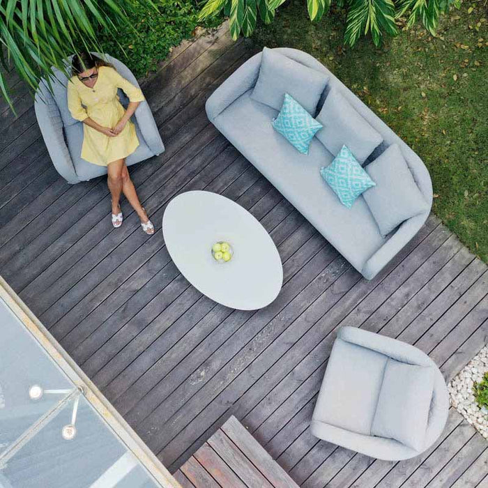 Top view of the Ambition 3 Seater Sofa Set in Lead Chine, featuring an oval coffee table, sofa, and armchairs, arranged on a wooden deck for a modern outdoor look.