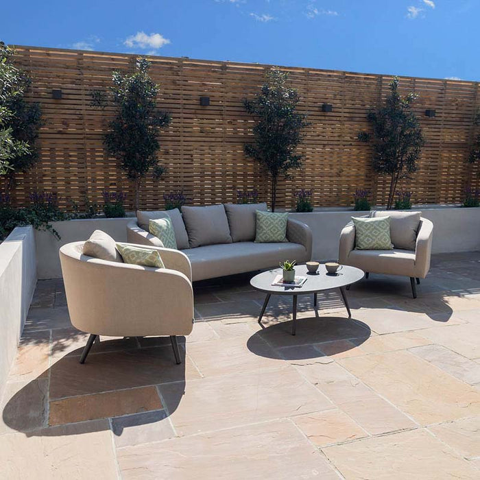 Full view of the Ambition 3 Seater Sofa with armchairs, arranged in an outdoor setting, displaying the complete set in oatmeal fabric.