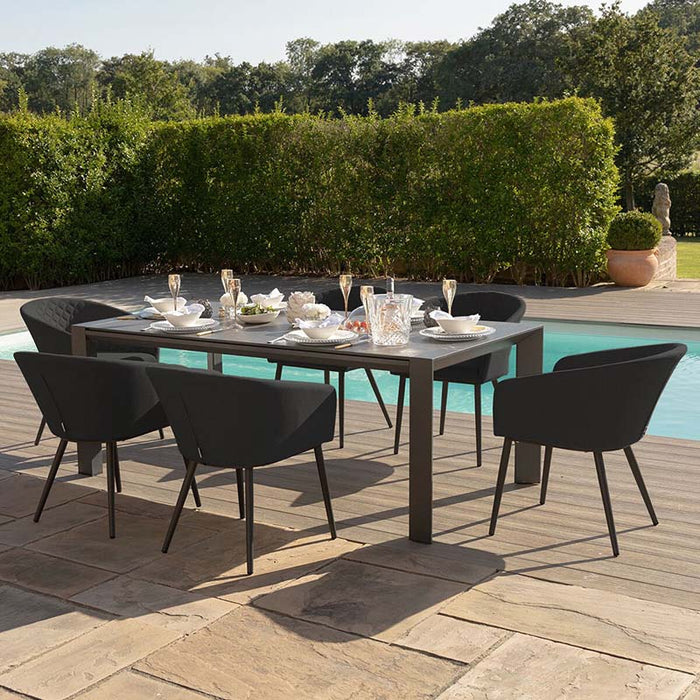 Ambition 6 seater extending dining set in charcoal, perfect for a stylish and modern outdoor dining experience by the pool.