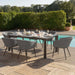 Ambition 6 seater extending dining set in flanelle, positioned stylishly near the pool for a comfortable outdoor dining experience.