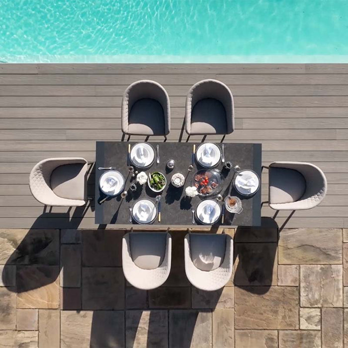 Top view of the Ambition 6 seater extending dining set in oatmeal, showing a stylish outdoor dining setup by the pool.