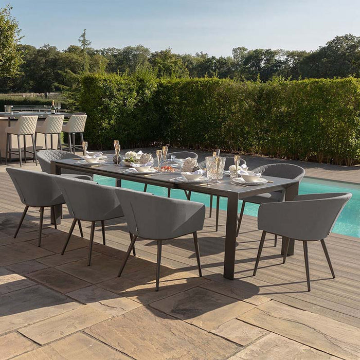 Ambition 8 seater extending dining set in flanelle, featuring a contemporary design perfect for outdoor dining by the pool.