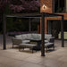 Como Aluminium Outdoor Garden Pergola with integrated LED lighting, creating a warm and inviting atmosphere in the evening over a modern outdoor lounge set.