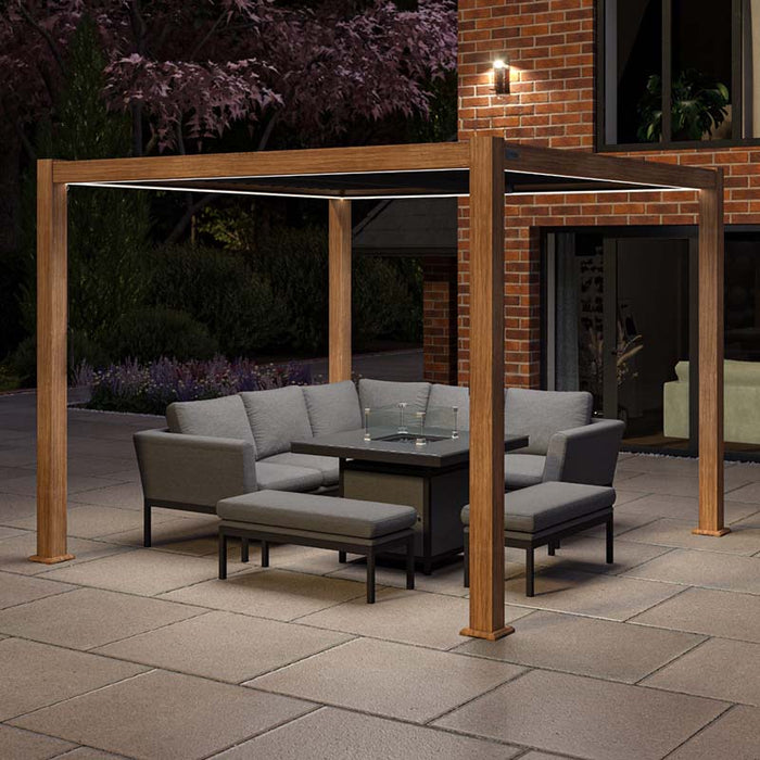 Como Aluminium Outdoor Garden Pergola in wood effect with integrated LED lighting, creating a cosy and inviting outdoor space for evening relaxation.