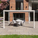 Maze Como 4m x 4m Aluminium Pergola in White, featuring an elegant dining area under a modern outdoor structure.