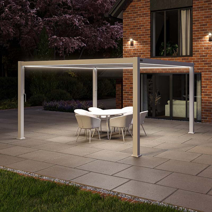 Maze Como Aluminium Pergola 4m x 4m in White, illuminated with soft LED lights at night, creating a serene outdoor environment.