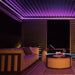 Eden Aluminium Garden Pergola illuminated with purple LED lights, creating a sophisticated and calming ambience for evening relaxation.