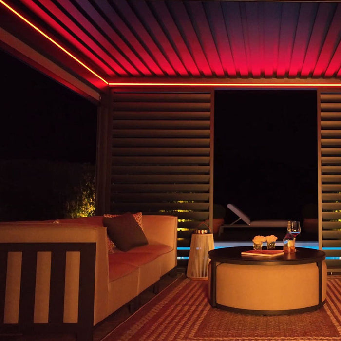 Eden Aluminium Garden Pergola glowing with dynamic red LED lighting, adding a bold and vibrant atmosphere to your outdoor space.