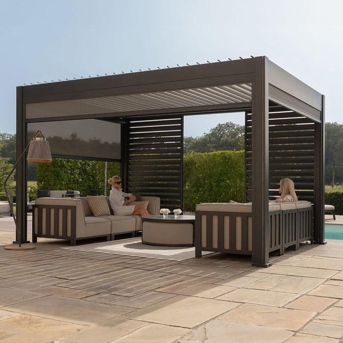 Right-angle view of the Eden Aluminium Garden Pergola, showcasing the motorised louvre system and minimalist grey frame design.