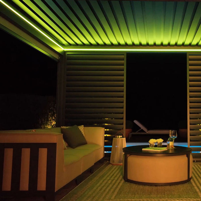 The pergola is bathed in yellow LED lights, adding a fresh and vibrant atmosphere to outdoor spaces, ideal for night-time lounging.