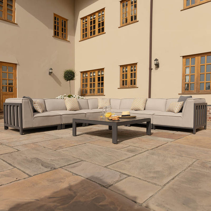 Low angle view of the Maze Ibiza Large Corner Sofa Set with Square Table, featuring modern outdoor design and durable materials, perfect for entertaining outdoors.