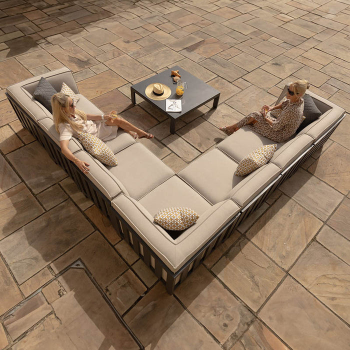 Top view of the Maze Ibiza Large Corner Sofa Set with Square Table, arranged in a lifestyle setting. Spacious design with elegant cushions, ideal for outdoor gatherings.