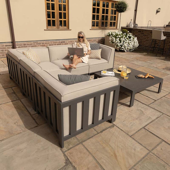 Lifestyle shot of the Maze Ibiza Small Corner Sofa Set with Square Table, showing its inviting design, perfect for stylish garden gatherings.