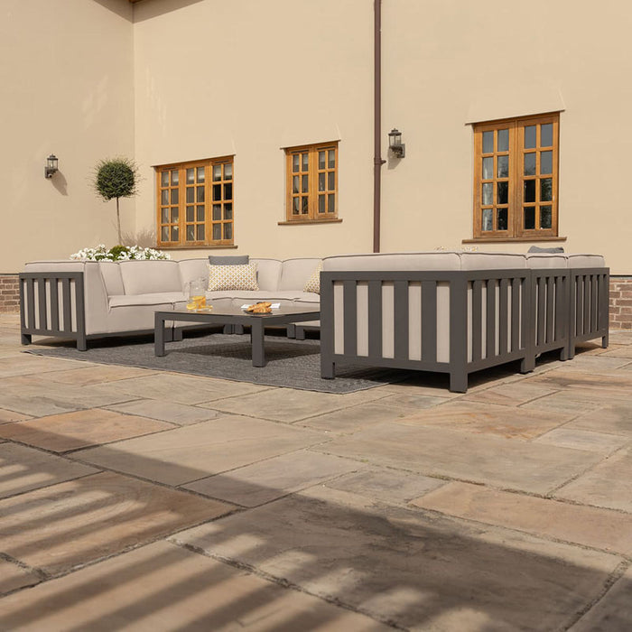 Low-angle view of the Maze Ibiza U Shape Sofa Set with Square Table, highlighting the sleek outdoor design and comfortable seating arrangement.