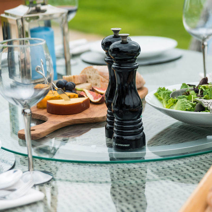 Close-up of the Maze Oxford Heritage dining table showing the Lazy Susan with champagne and glasses, emphasising the set's elegant dining features.