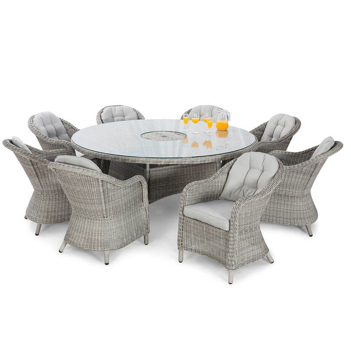 The maze Oxford Heritage 8 Seater Round Dining Set on a white background, showing the full arrangement of grey rattan chairs around the glass-top table