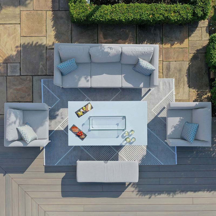 Aerial view of Maze Pulse 3 Seater Sofa Dining Set with Fire Pit in lead chine colour, showcasing a modern U-shaped layout with a central fire pit table on a geometric outdoor rug.