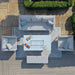 Aerial view of Maze Pulse 3 Seater Sofa Dining Set with Fire Pit in lead chine colour, showcasing a modern U-shaped layout with a central fire pit table on a geometric outdoor rug.