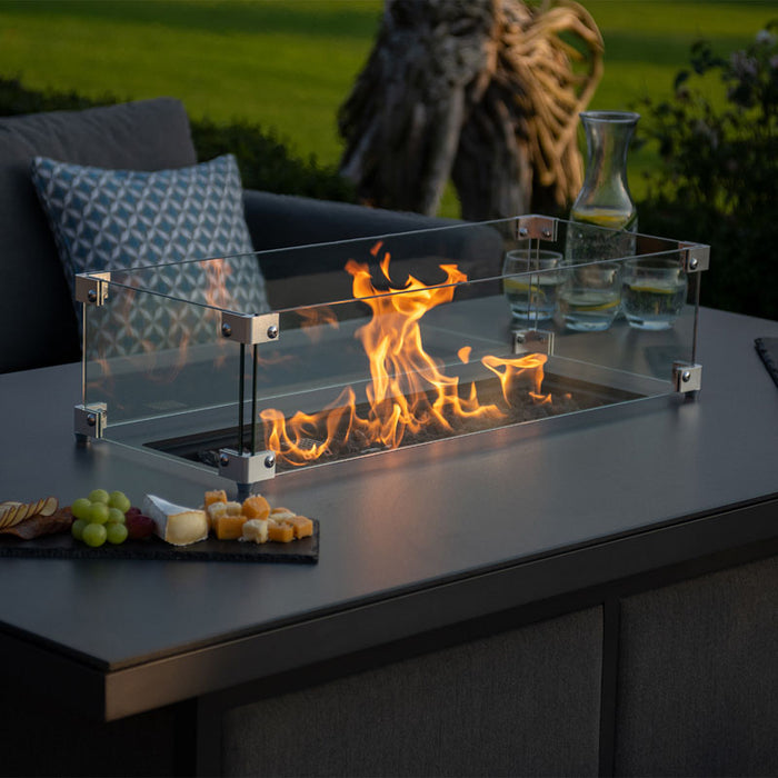 Detailed shot of the flames inside the fire pit of the Pulse 3 Seater Sofa Dining Set, with the glass guard enhancing the stylish look.