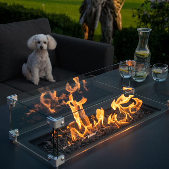 Another angle of the fire pit in the Pulse 3 Seater Sofa Dining Set, with flames glowing against the charcoal finish.