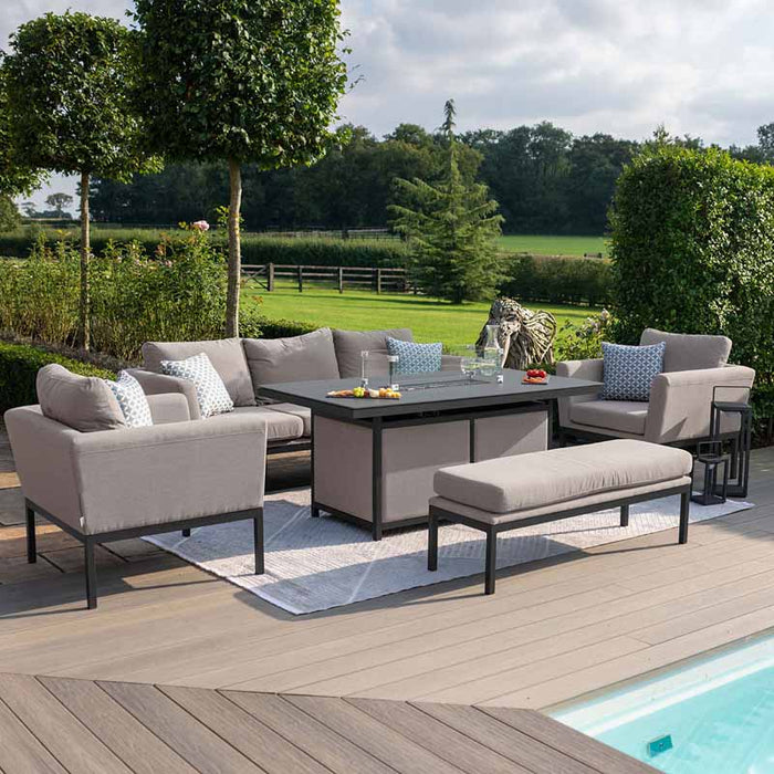 A stylish Pulse 3 Seater Sofa Set in taupe, featuring a modern dining table with an integrated fire pit, ideal for cosy outdoor evenings.