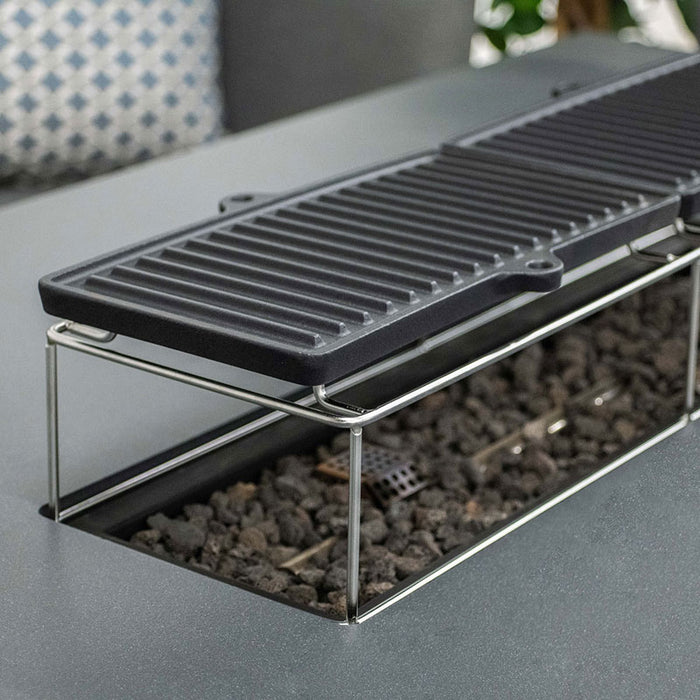 Sturdy and convenient grilling plates make the fire pit versatile for outdoor cooking.